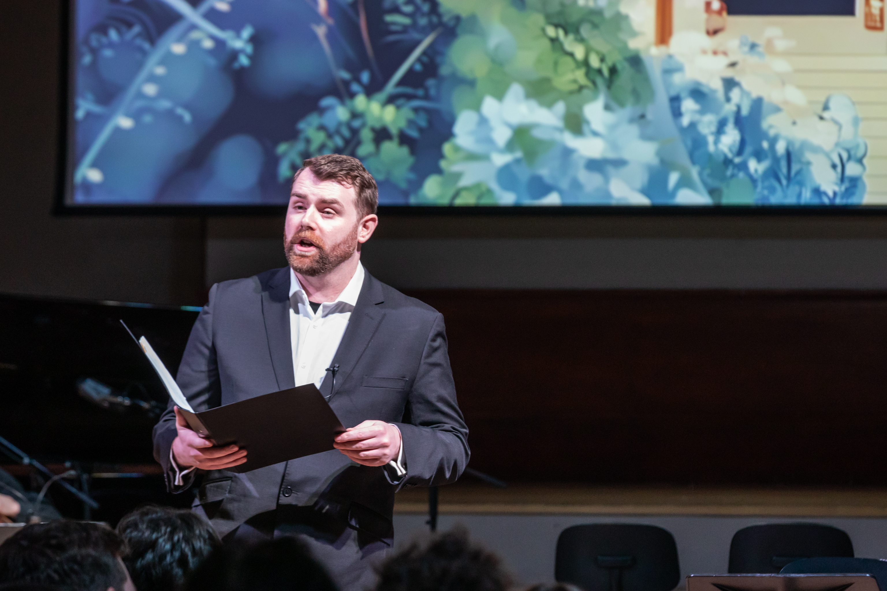 Jacob performing with visual projections